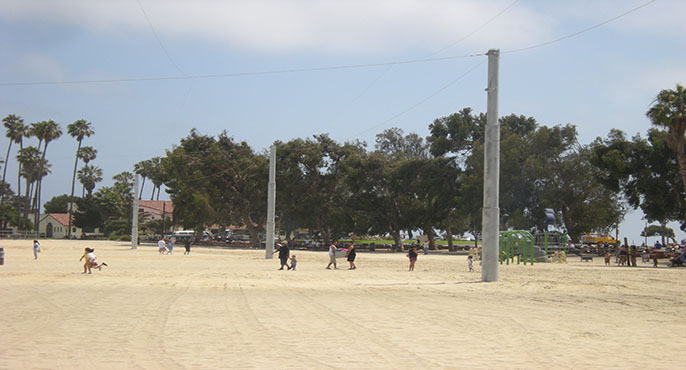 Metal cables tethered to tall metal poles are suspended in a grid pattern over the heads of beachgoers at Inner Cabrillo Beach in an effort to deter birds from depositing droppings at the beach.