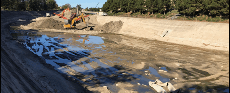 SCCWRP and the Southern California Stormwater Monitoring Coalition have begun working to understand how to protect and restore the biological health of Southern California’s engineered channels, including this one, above, that depicts a field crew removing accumulated sediment as part of channel maintenance. The study will examine whether physical habitat restoration strategies can be expected to improve stream biological health.