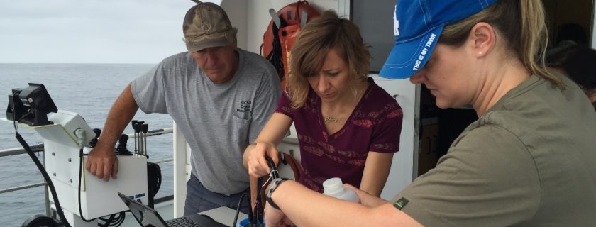 George Robertson of the Orange County Sanitation District, left, and Ashley Booth, center, and Erin Oderlin of the City of Los Angeles Sanitation calibrate and prepare an XPRIZE-developed ocean pH monitoring sensor for a test deployment in nearshore waters off Crystal Cove. All four of SCCWRP’s POTW member agencies participated in the training exercise in early August.